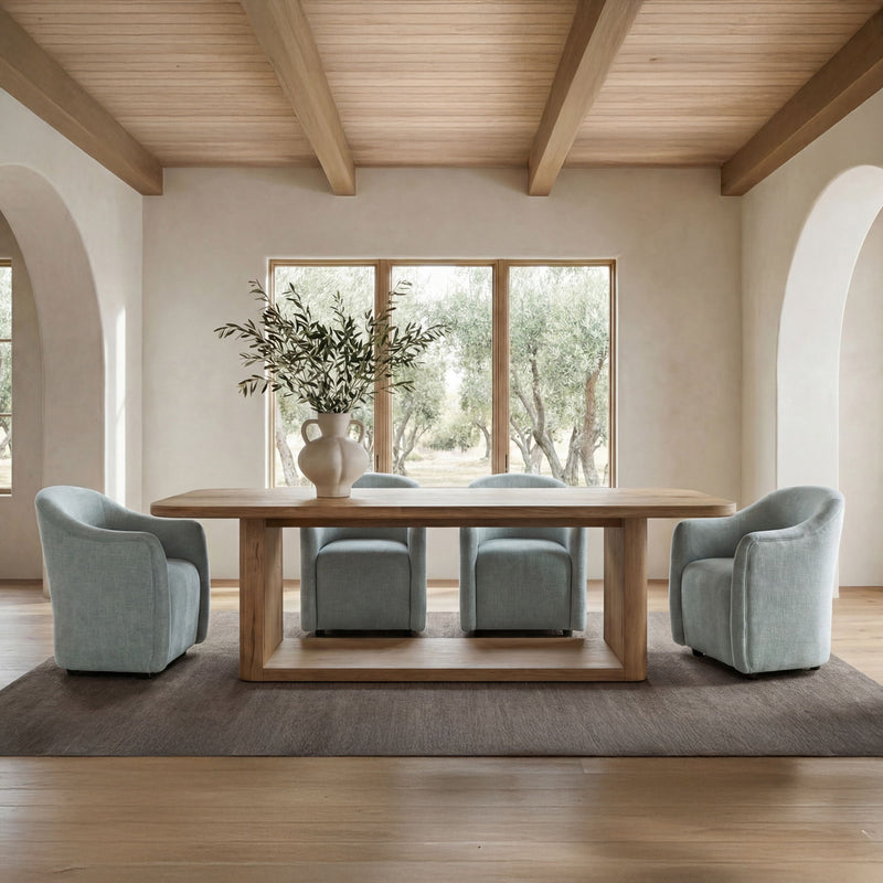 Green rolling dining chair, rounded upholstered back and arms