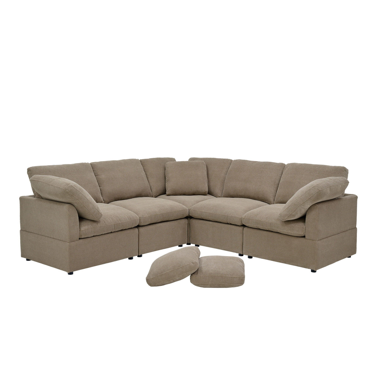 Camel modular L-shaped sofa with plush cushions, wide arms, and two loose pillows.