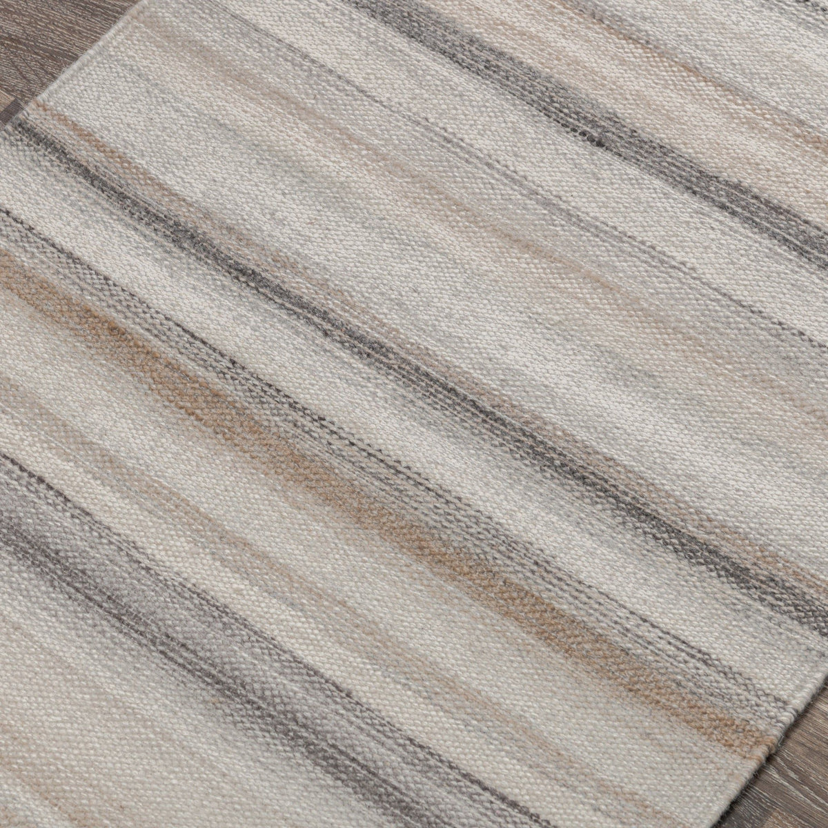 Close-up of ivory area rug weave with thin horizontal gray stripes