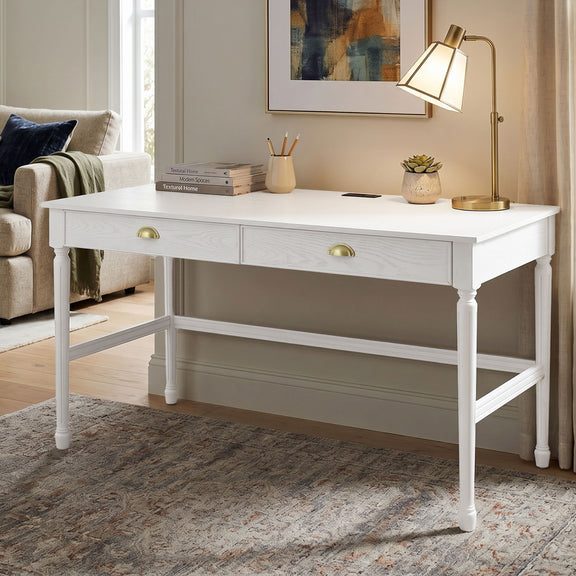 White writing desk with two drawers, brass-tone pulls, and lower shelf