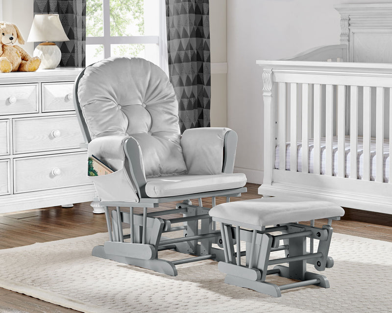 Light gray upholstered glider chair with matching ottoman, rocking base visible.