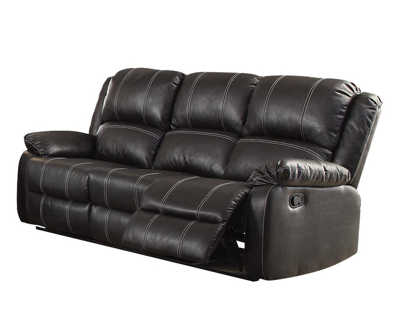 Black recliner sofa with tufted back, padded arms, and reclining seat