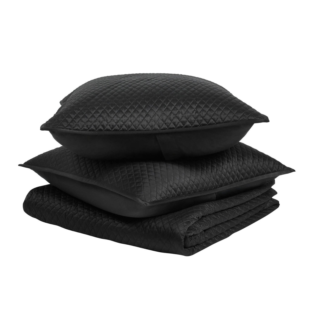 Diamond quilt set in onyx black: folded quilt with stacked textured shams