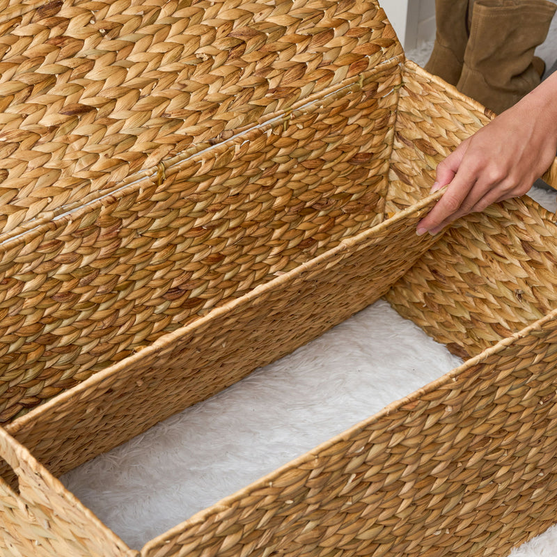 Woven storage trunk with lid lifted to reveal its lined interior