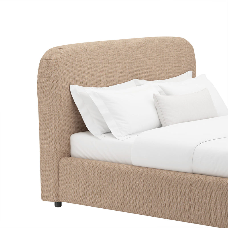 Rounded beige upholstered bed frame with vertical channel headboard and tapered legs