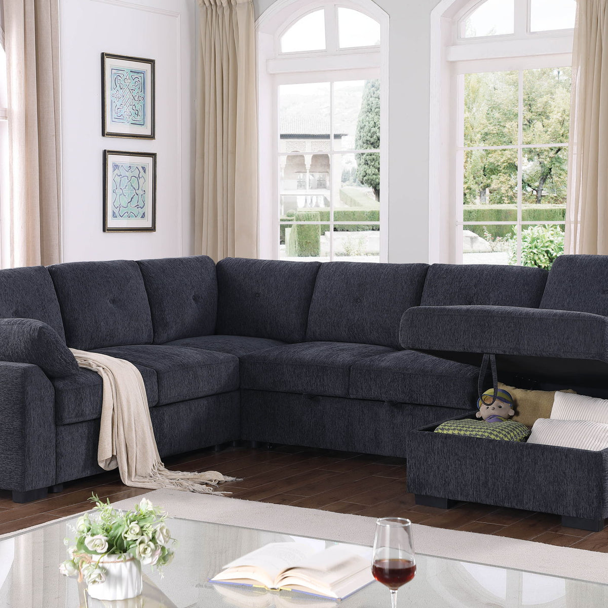 Dark gray upholstered sectional with chaise and pull-out loveseat style storage