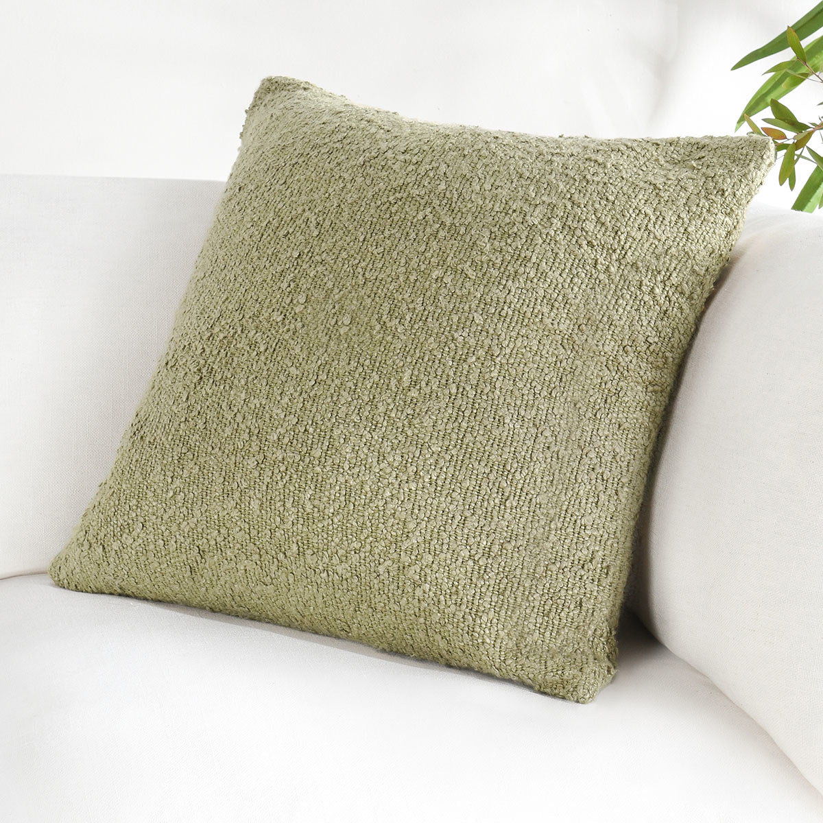 Wheat green square throw pillow with textured fabric, shown upright