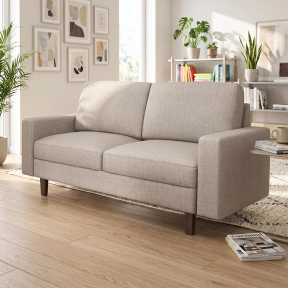 Beige loveseat with two seat cushions, two back cushions, and tapered wooden legs