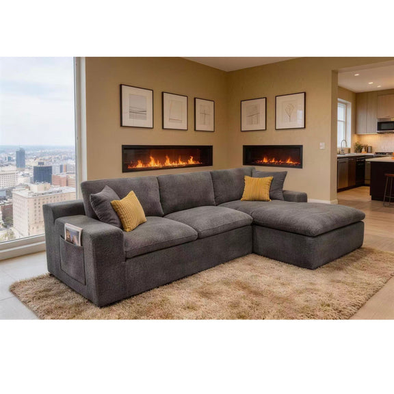Dark gray U-shaped sectional sofa with two yellow pillows and light throw blanket