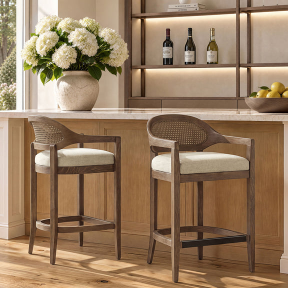Light brown mid-century counter stool with cane back and upholstered fabric seat