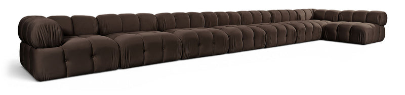 L-shaped velvet sectional sofa in dark brown with tufted cushions and rolled arms