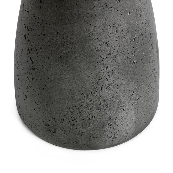 Outdoor accent table, dark gray speckled concrete pedestal body close-up