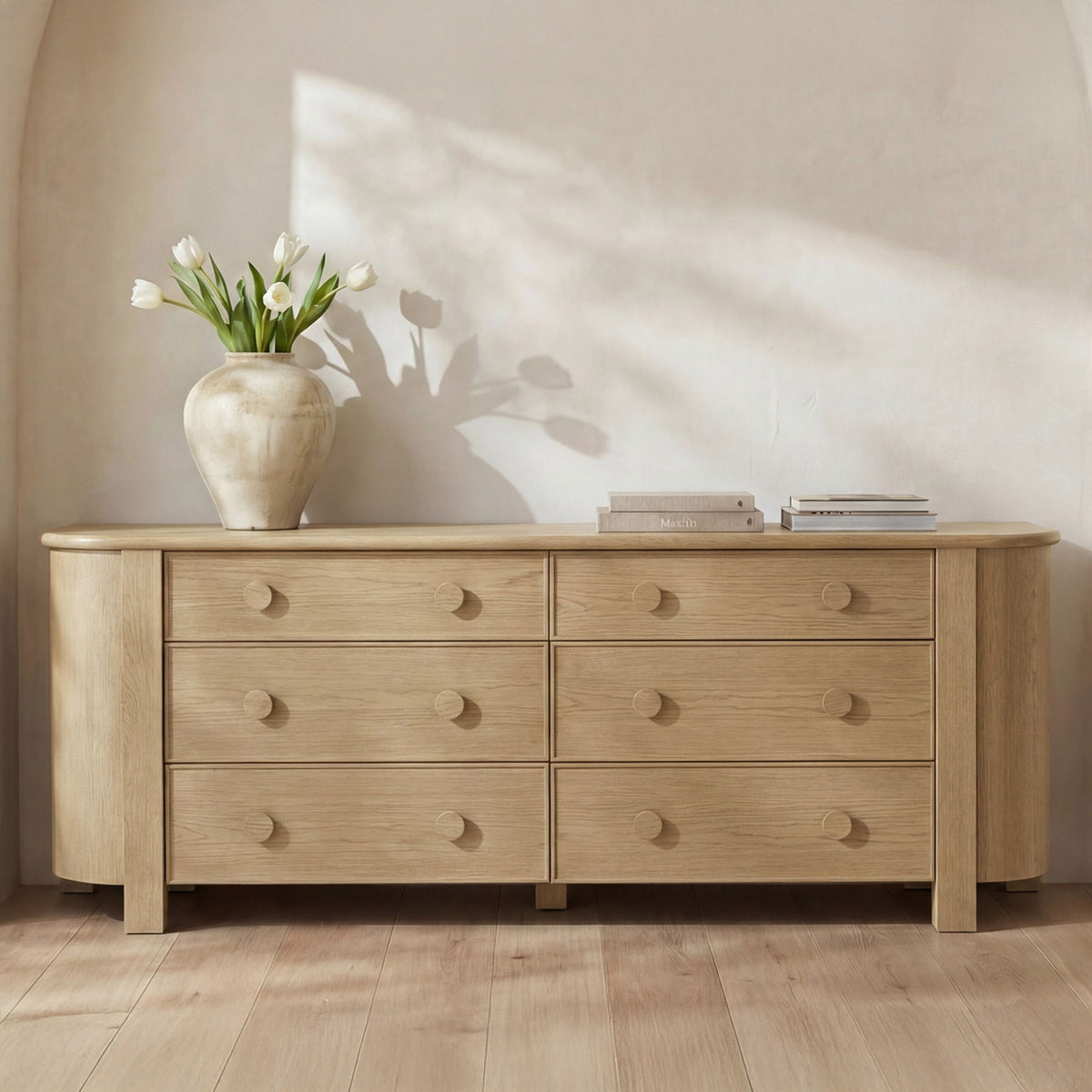 Natural wood 6-drawer dresser with round drawer pulls and tapered legs