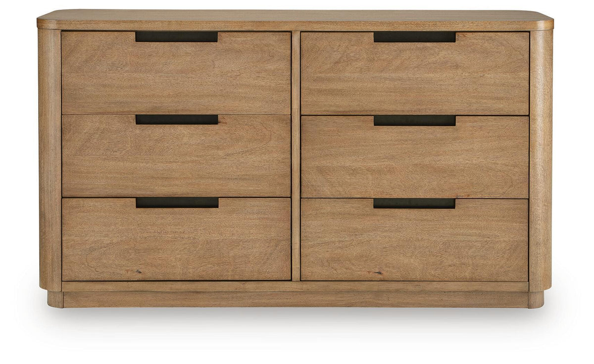 Light brown wood dresser with four drawers and black bar handles