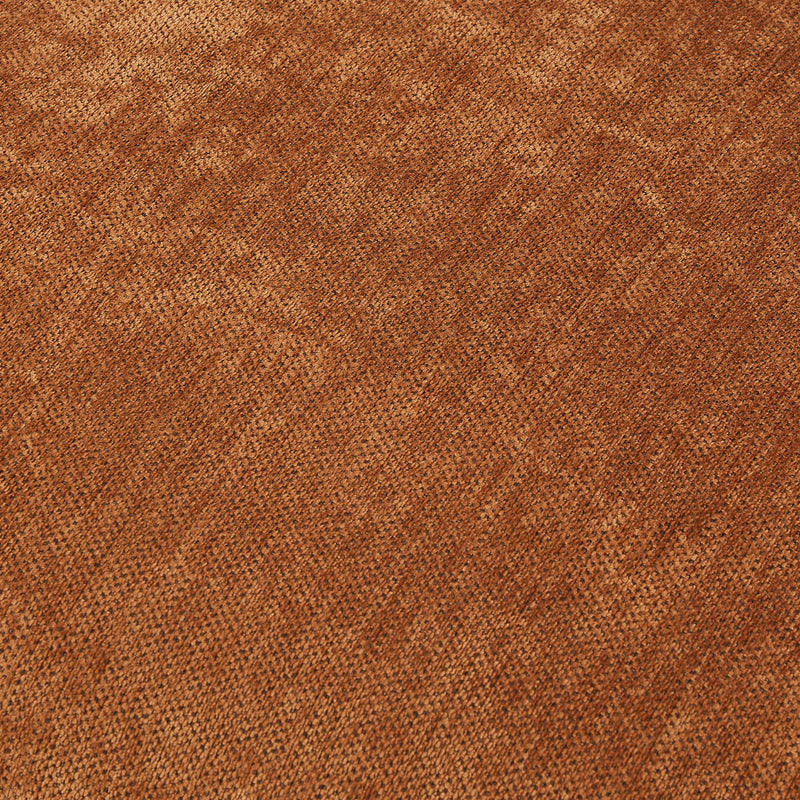 Orange sofa fabric close-up showing a woven texture