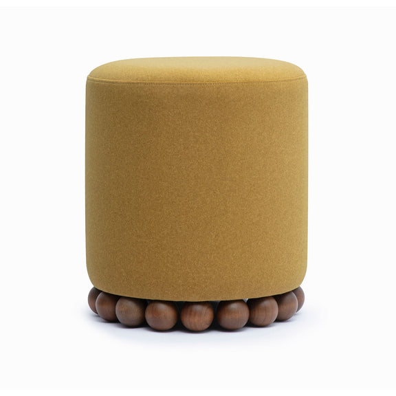 Round upholstered ottoman in light brown with beaded wooden base
