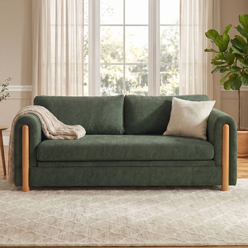 3-seater upholstered couch in dark green with wooden arms and accent pillows