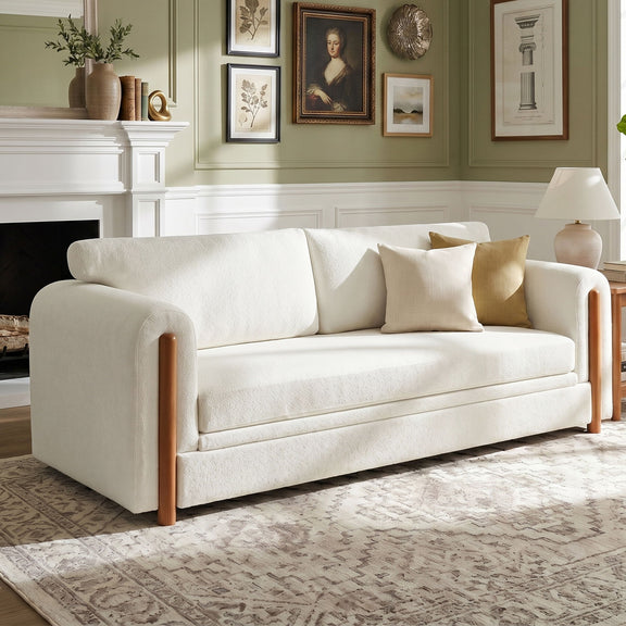 3-seater upholstered couch in white with square arms and wooden legs