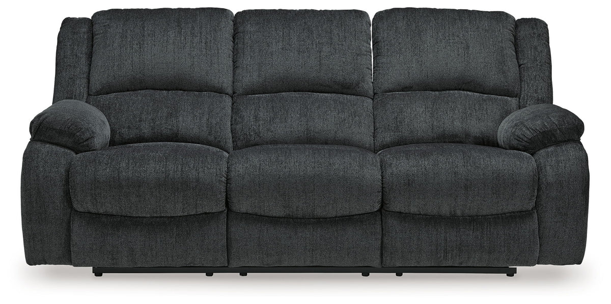 Dark gray reclining sofa, straight front view with three seat sections and armrests
