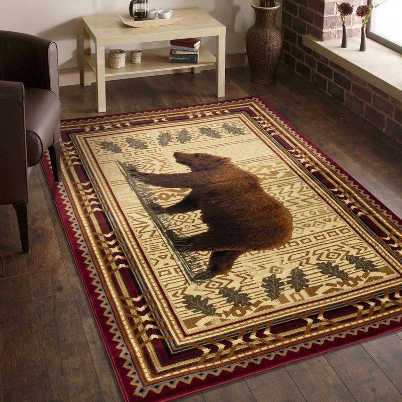 Lodge area rug with beige center, dark bear silhouette, and red geometric border