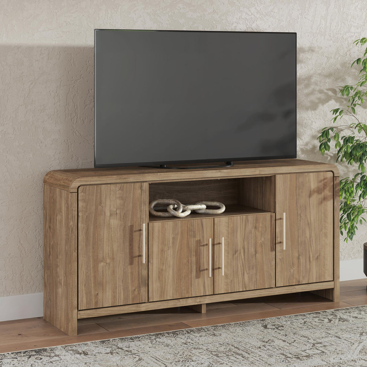 Brown wooden TV stand with TV on top and three cabinet doors