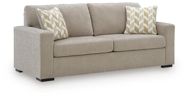 Bridgepoint sofa in light beige fabric, two seat cushions, two patterned throw pillows