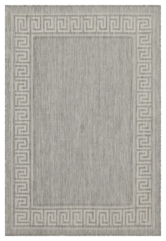 Light gray area rug with dark gray Greek key border and lightly textured center.