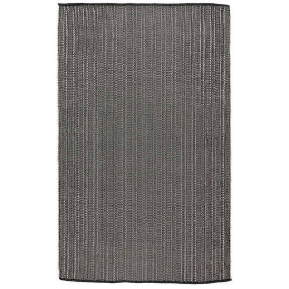 Charcoal indoor/outdoor rug with flat woven texture and short fringe edging.