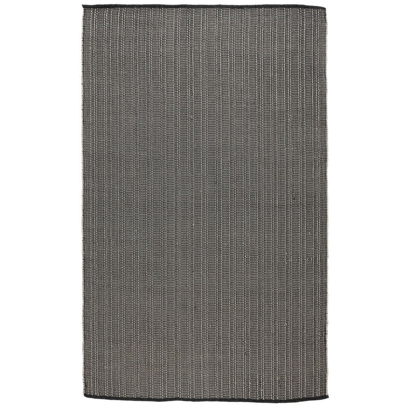 Charcoal indoor/outdoor rug with flat woven texture and short fringe edging.