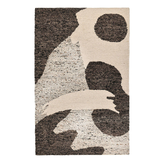 Cream and dark brown abstract area rug with textured pile and scattered shape clusters.