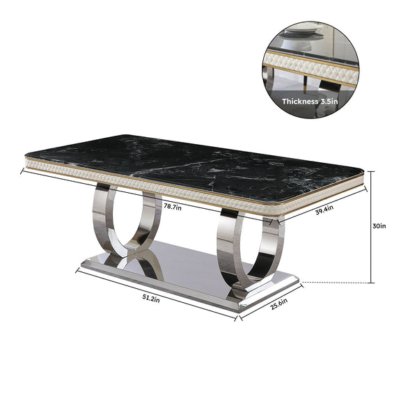 Black marble-look tabletop with gold trim and polished metal pedestal dining table base