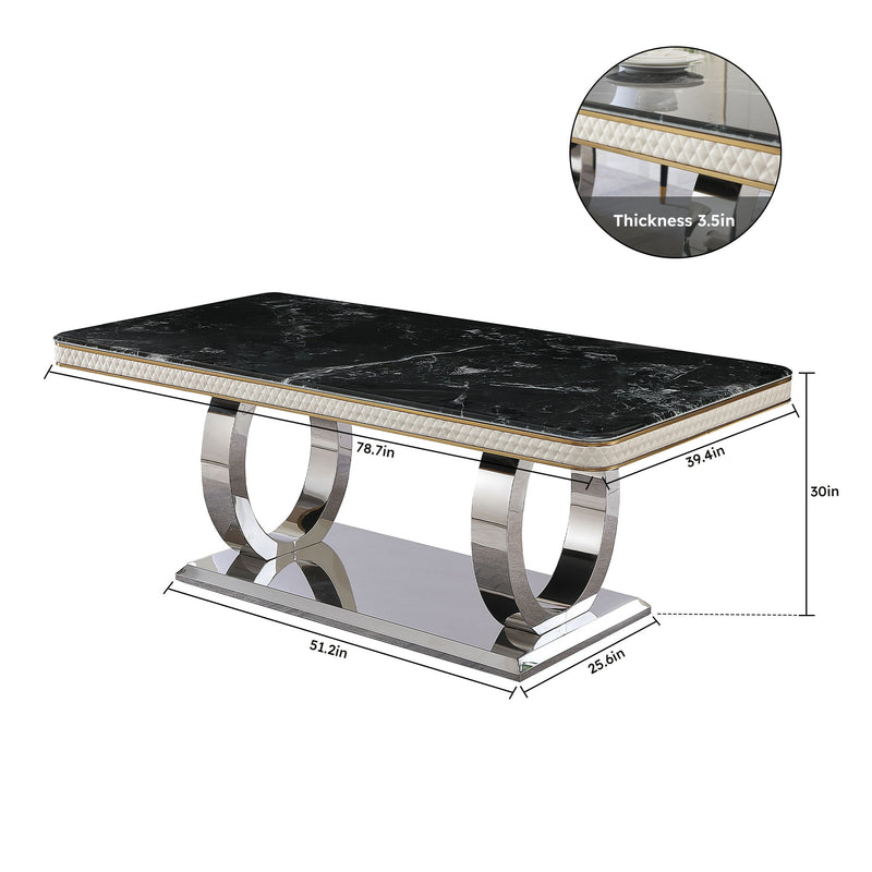 Black marble-look tabletop with gold trim and polished metal pedestal dining table base