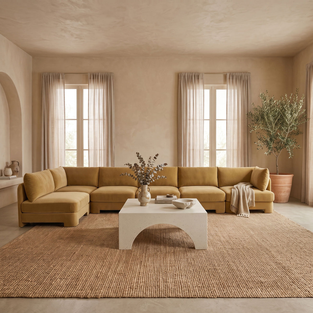 Tan L-shaped armless sectional sofa with velvet-style upholstery and multiple seat modules