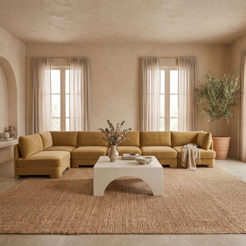 Tan L-shaped armless sectional sofa with velvet-style upholstery and multiple seat modules