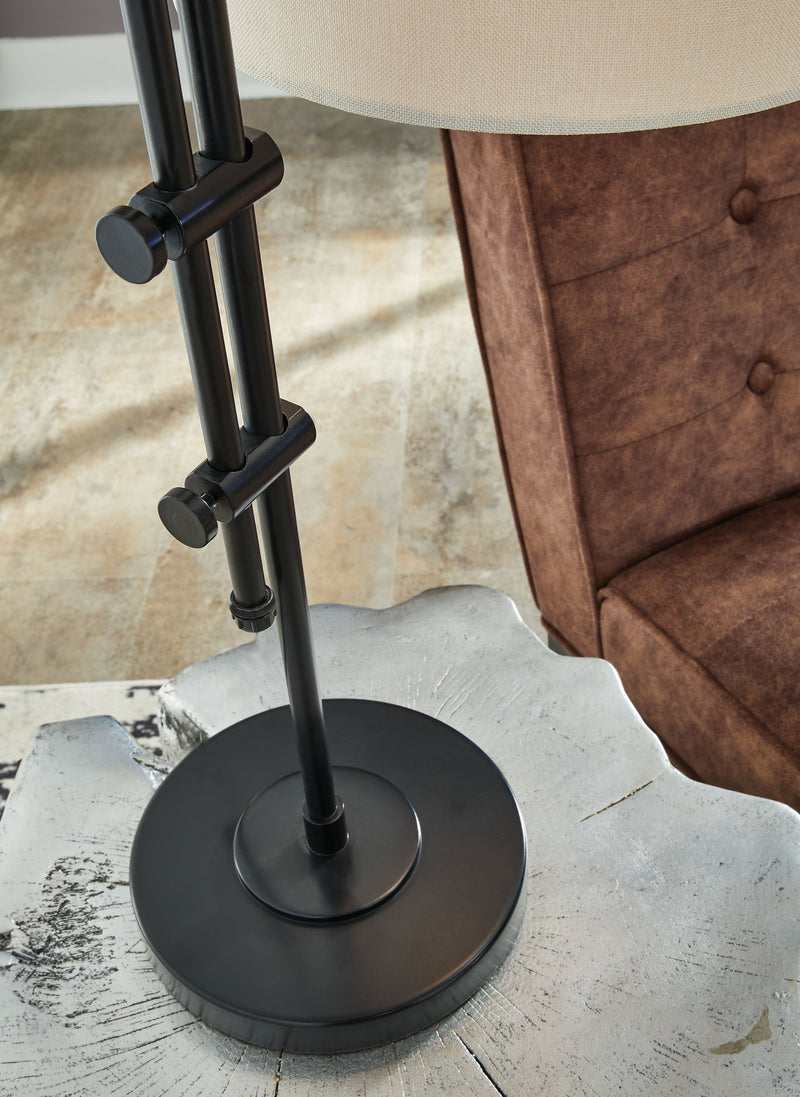 Black metal floor lamp base with round pedestal and vertical pole with brackets.