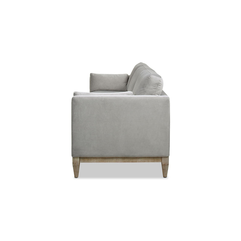 Modern farmhouse sofa in light gray, square arms and tapered wood legs.