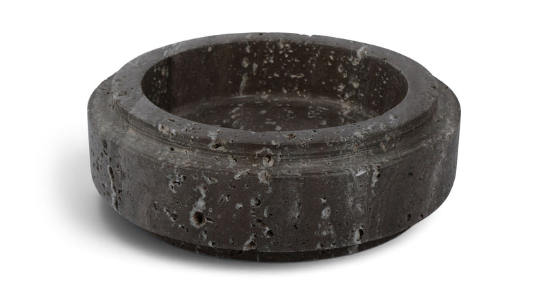 Charcoal gray travertine bowl with round rim and speckled stone surface