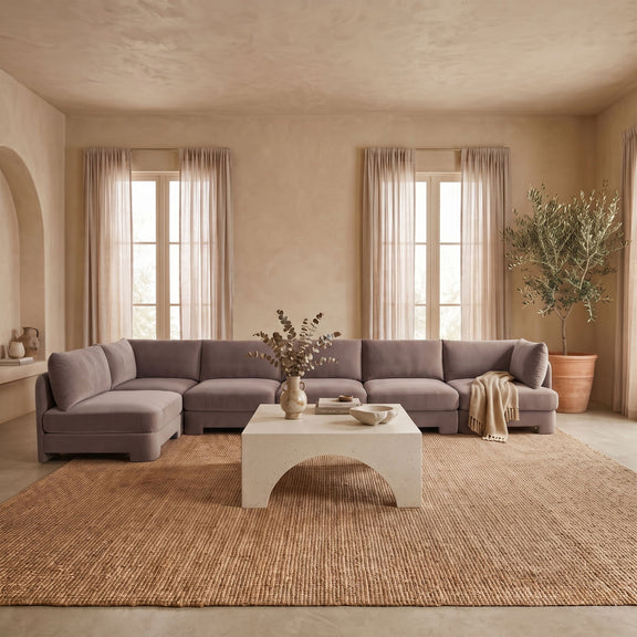 Gray L-shaped armless sectional sofa with velvet-look upholstery and chaise corner