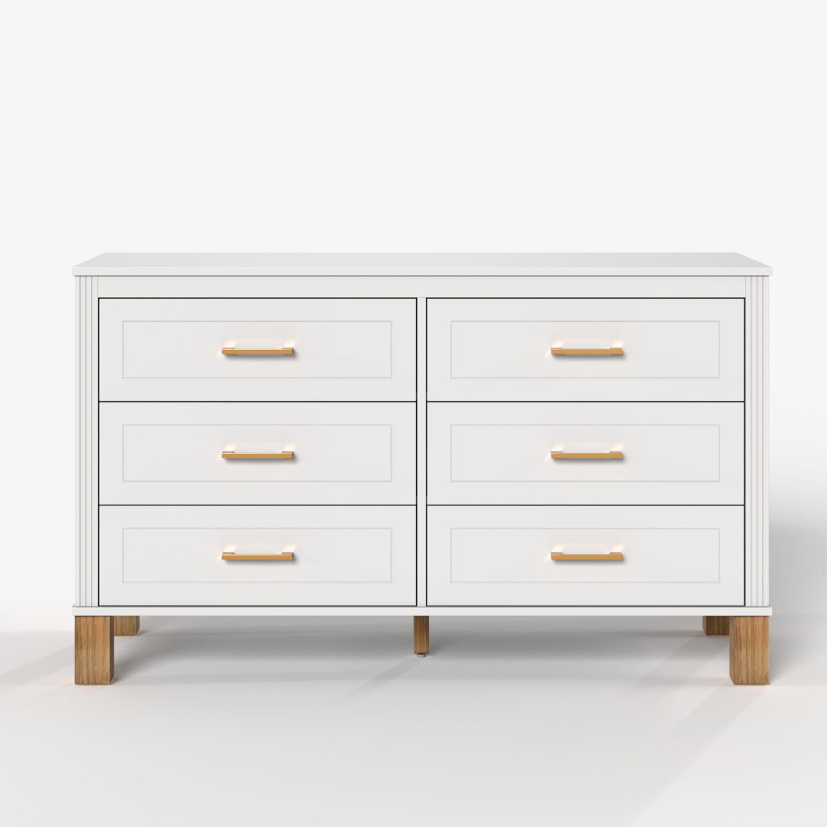 White double dresser with six drawers and gold-tone bar pulls, wooden legs.