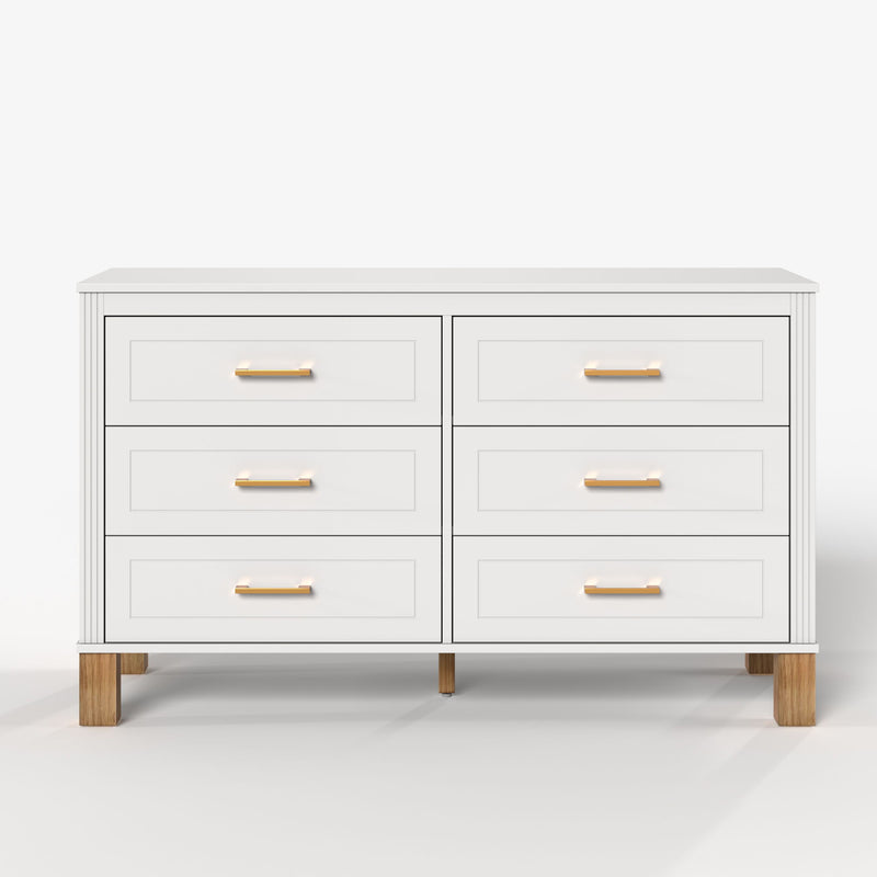 White double dresser with six drawers and gold-tone bar pulls, wooden legs.