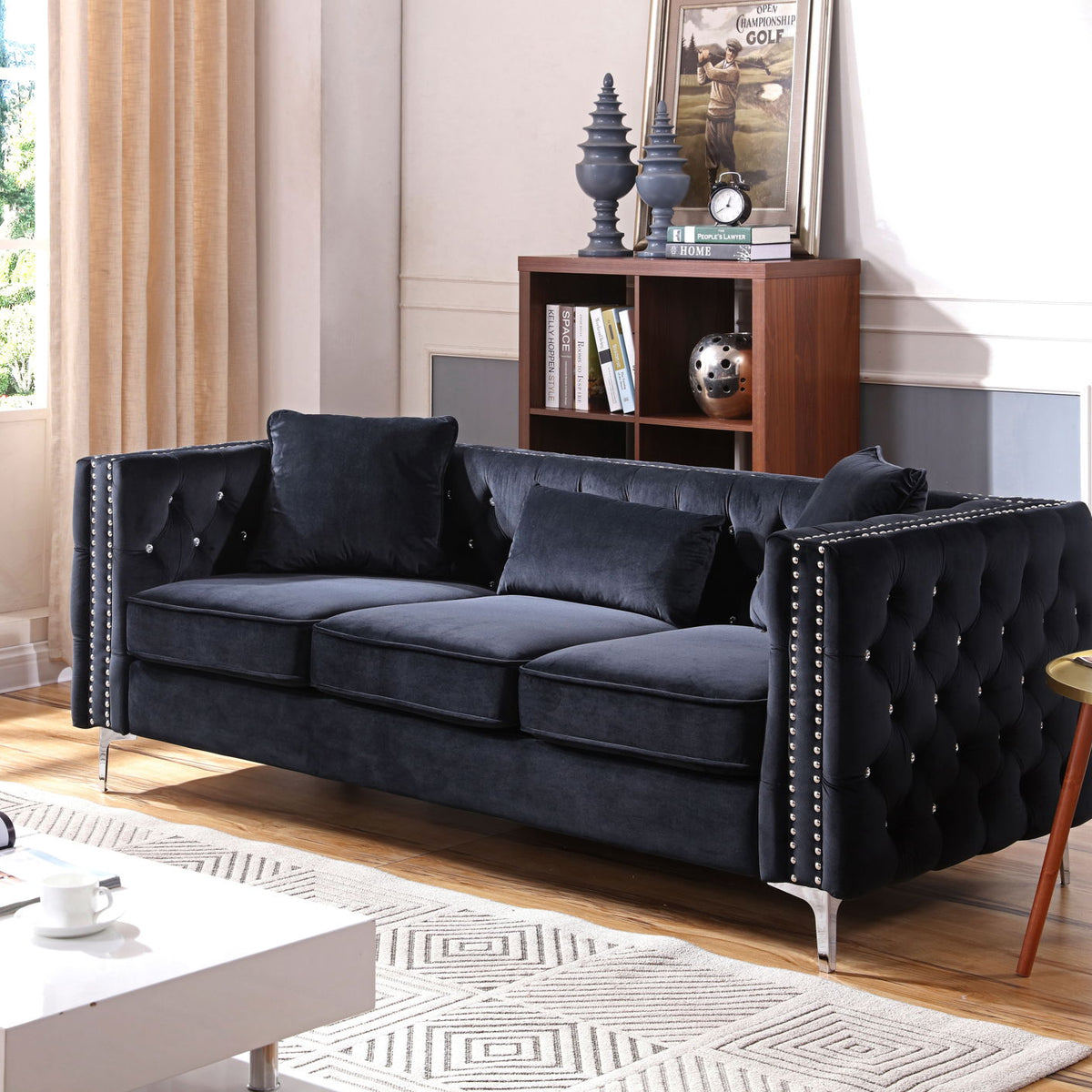 Paige sofa in dark fabric with tufted back, nailhead trim, and wide armrests