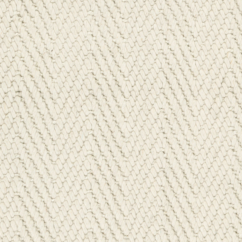 Close-up chenille herringbone rug texture, off-white zigzag weave