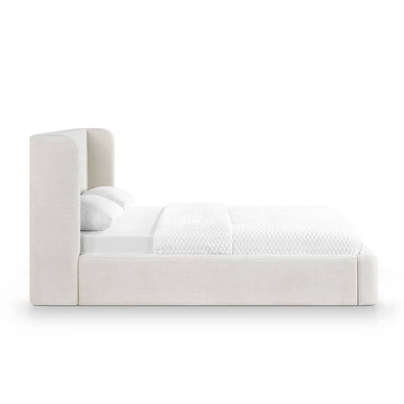 Upholstered platform bed with tall headboard, white fabric finish and cushioned sides