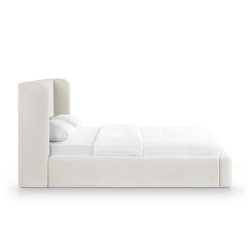 Upholstered platform bed with tall headboard, white fabric finish and cushioned sides
