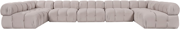 Light gray modular U-shaped sectional sofa with tufted cushions and rounded arm sections