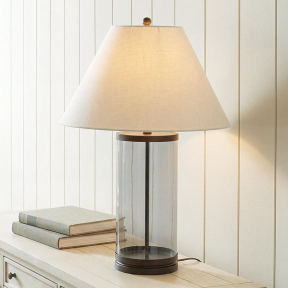 Junrow glass table lamp with beige fabric drum shade, clear cylinder body, dark base ring