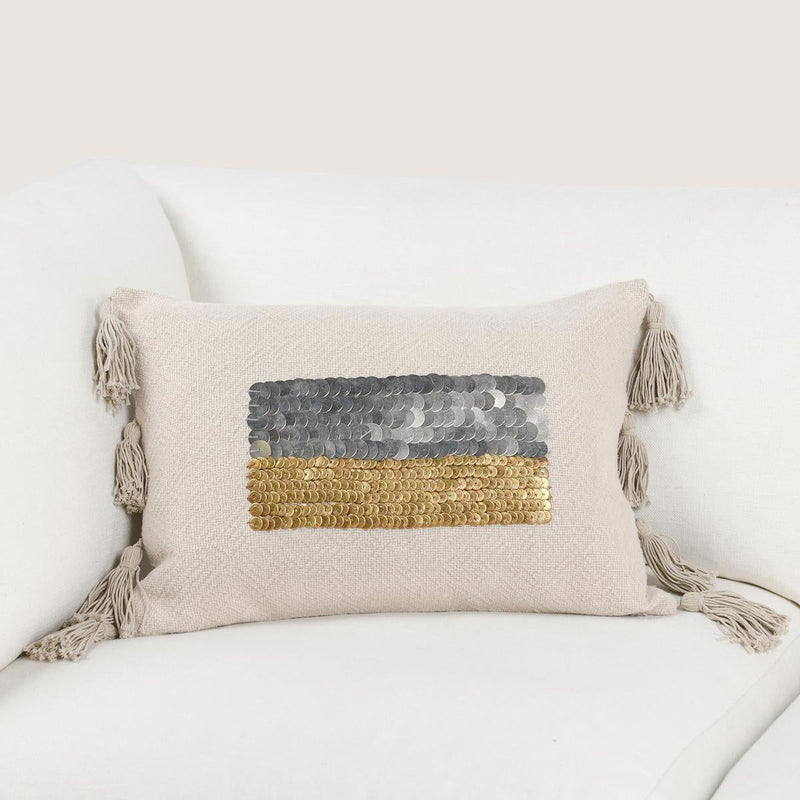 Natural 14x20 pillow with centered gray and gold sequin stripe and four tassel ties