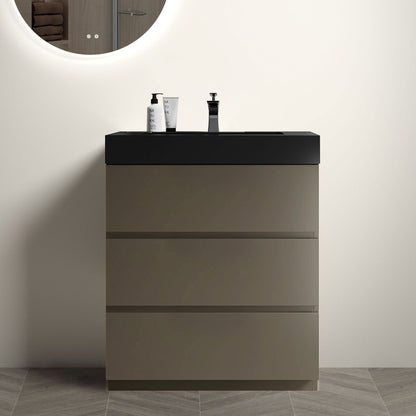 Bathroom vanity with black countertop, three drawers, and built-in sink in dark gray/black finish.