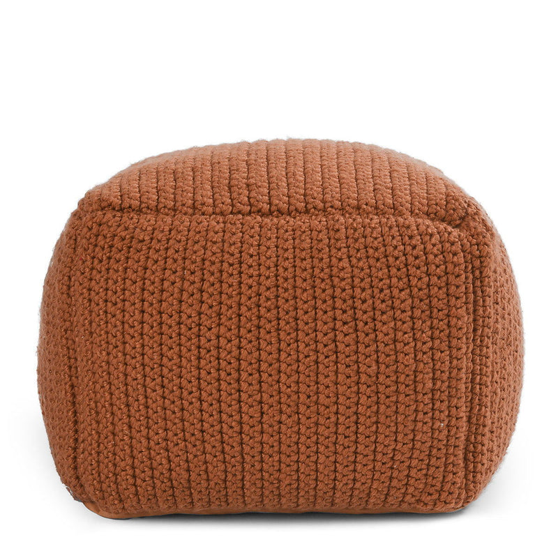 Terracotta knitted pouf with ribbed texture and rounded cylindrical shape