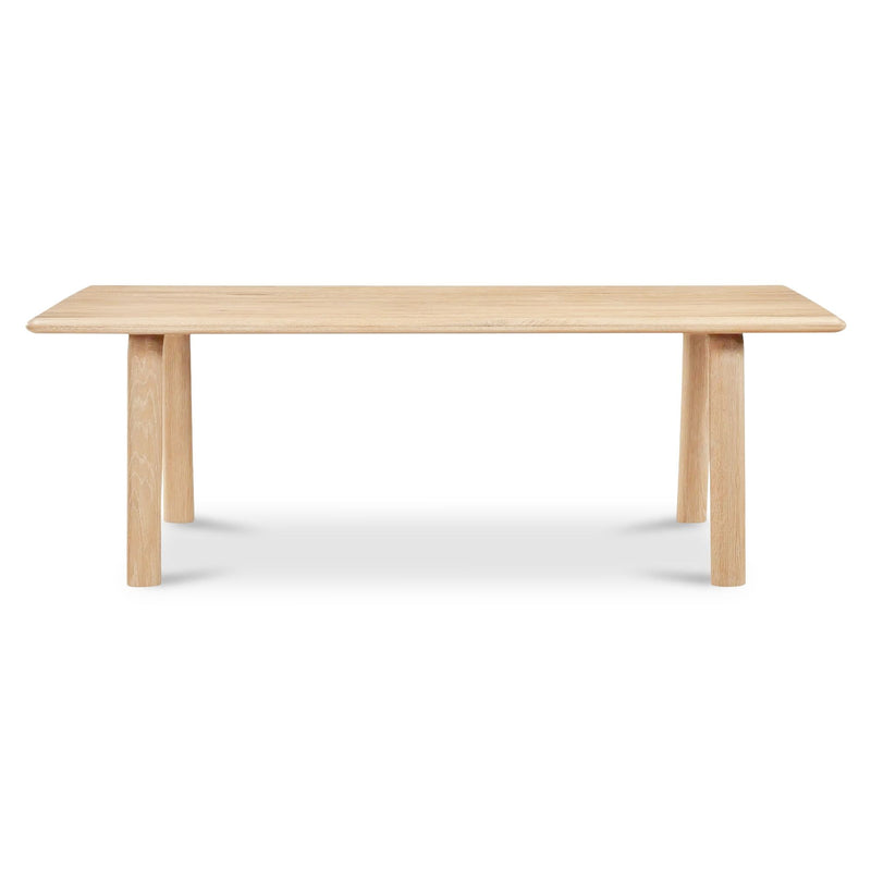Light oak dining table with rectangular top and four tapered legs